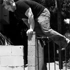 Man jumping over fence