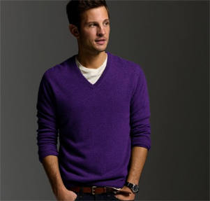 A man wearing a purple sweater