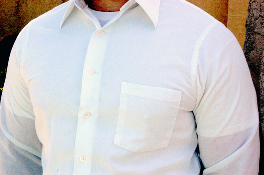White undershirt under a white dress shirt