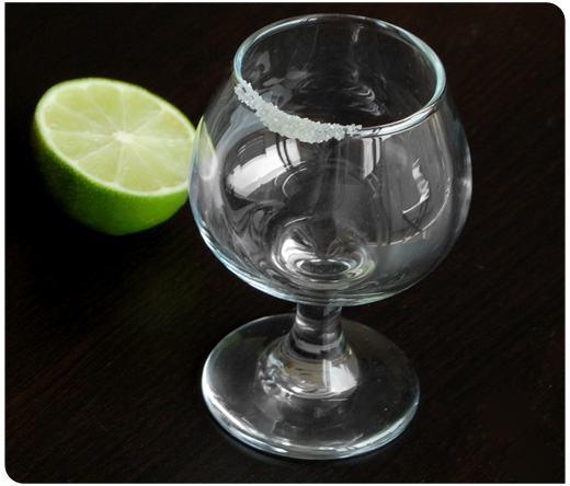 tequila glass with salt and lime