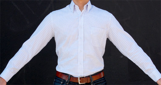 man wearing dress shirt with arms extended