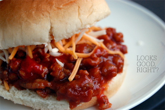 A close up of a sandwich on a plate, with Sloppy joe 