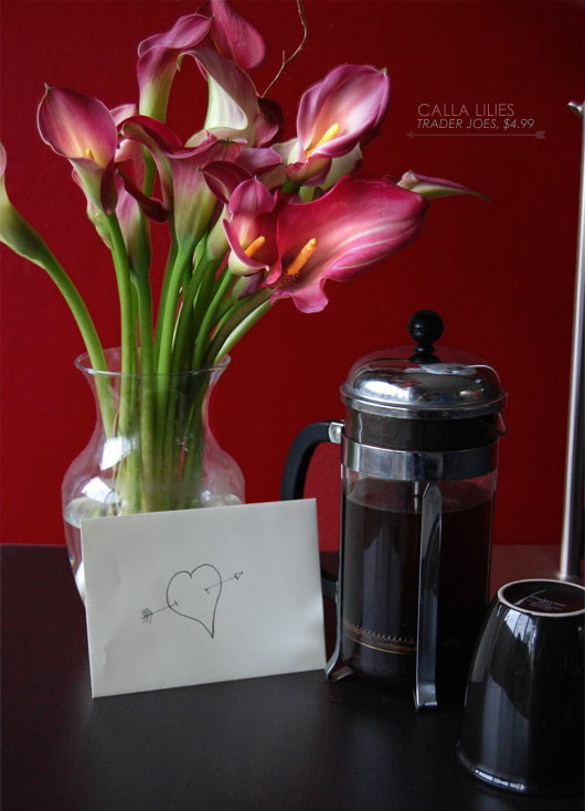 calla lilies Trader Joes $4.99 with calla lilies in a vase with a letter in an envelope and pressed coffee all set on a table