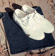 White sneakers and shoe bag