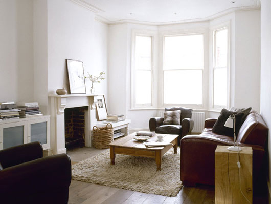 A living room filled with furniture and a large window