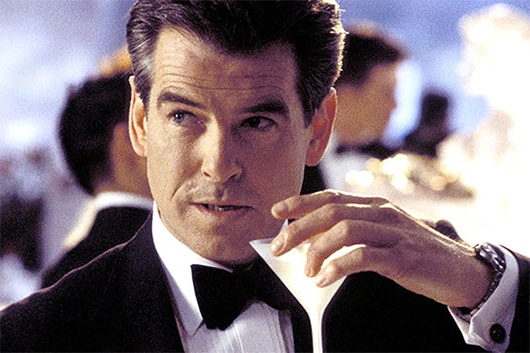 Pierce Brosnan wearing a suit and tie