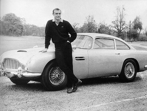 Sean Connery standing next to car