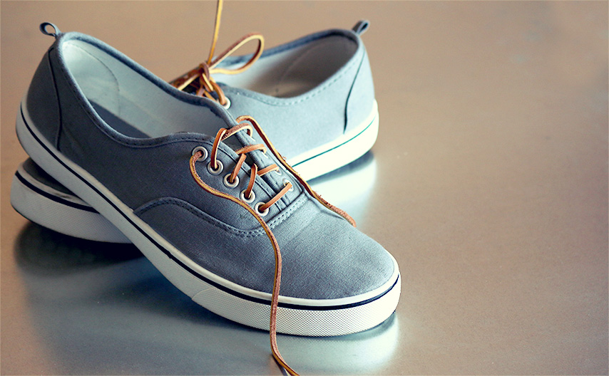 A pair of canvas shoes with leather laces