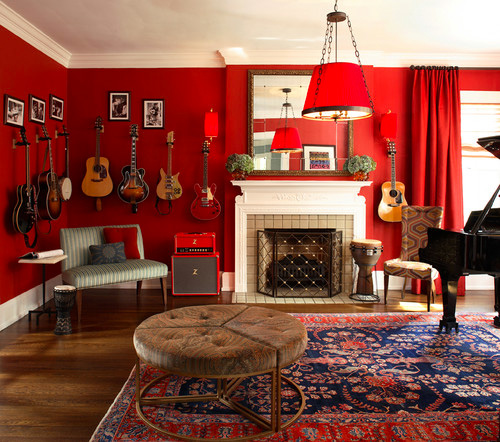 A red living room with guitars