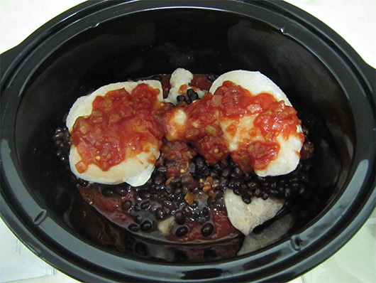 Slow cooker with food inside