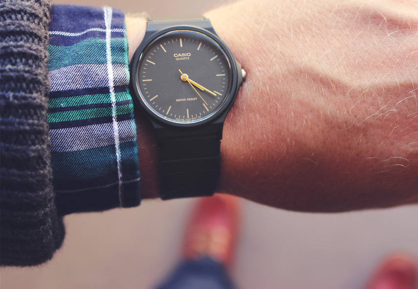 A black Casio watch on wrist