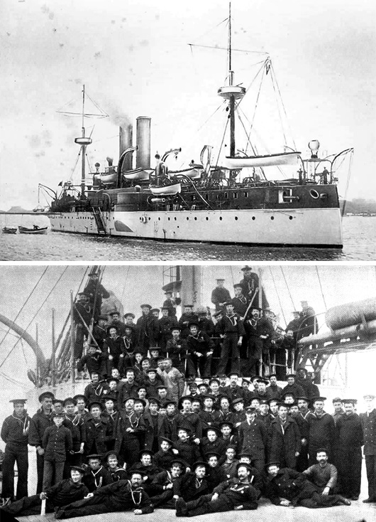 A group of people standing in front of a large ship in the background