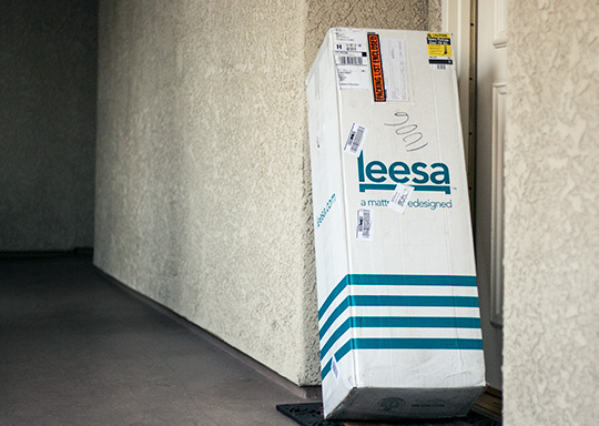 Leesa mattress box sitting outside home