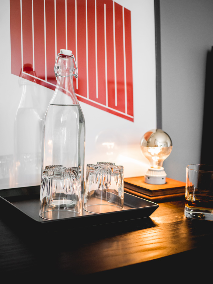 Water carafe and glasses in bedroom