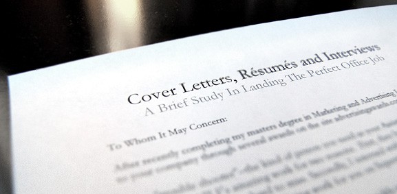 cover letters, resumes and interviews paper on table