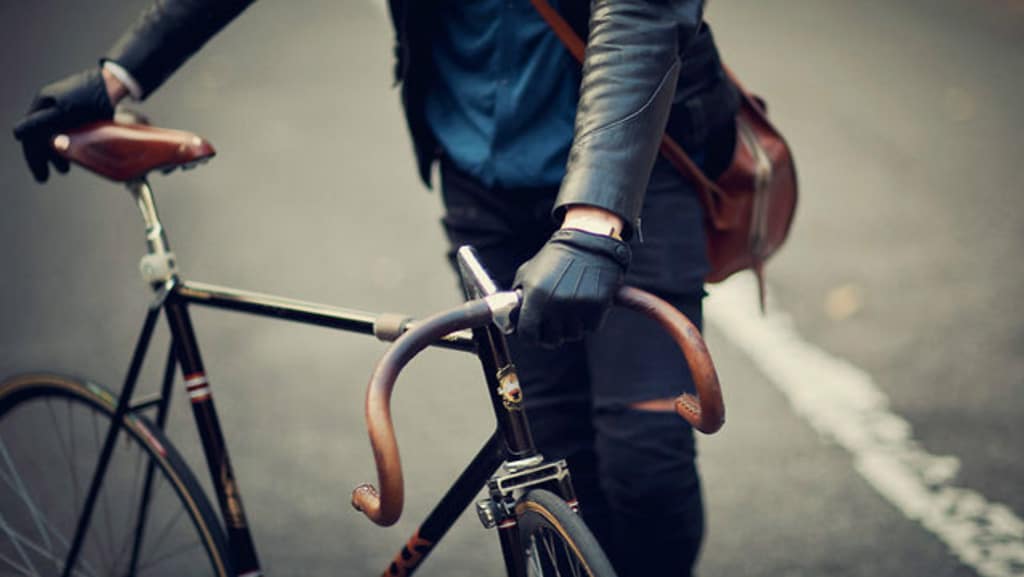 men black leather gloves with bicycle