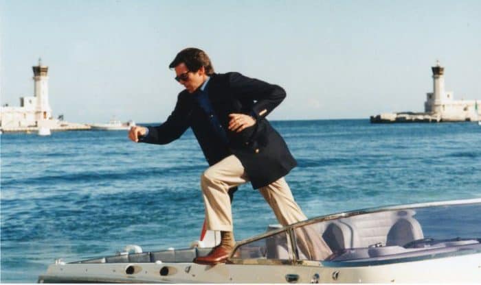 Pierce Brosnan as James Bond sports a blue blazer and tan khakis for a nautical look