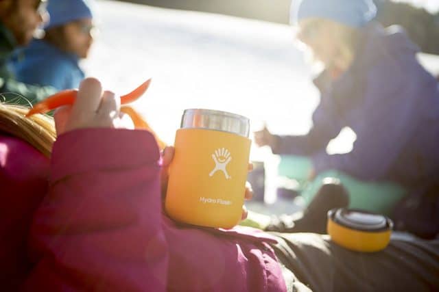 Shot of a young camper holding a hydro flask food flask