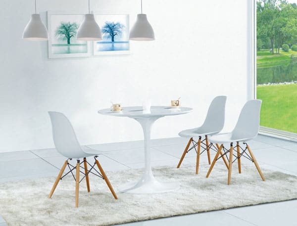 3 white chairs and a white table