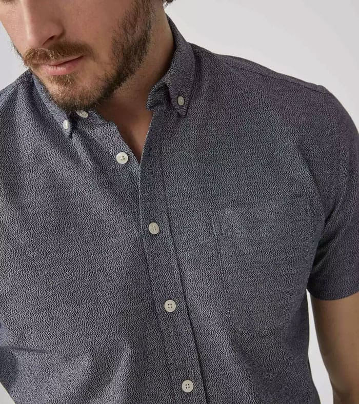 A man wearing a gray shirt