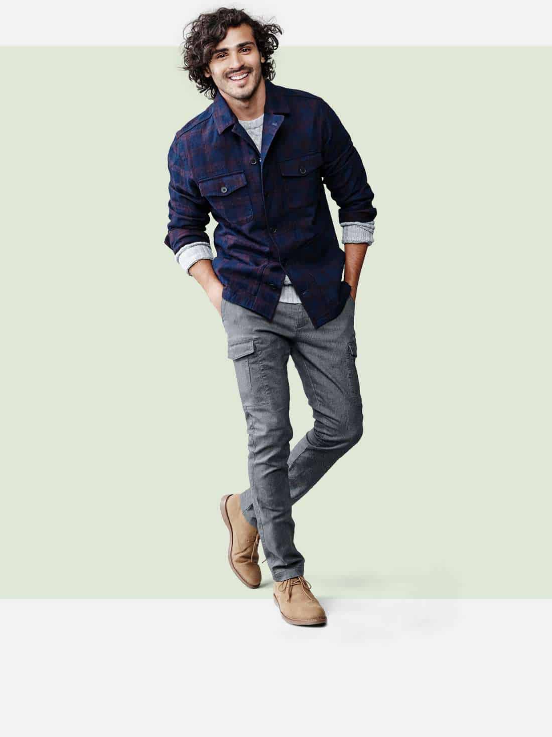 A man modeling shirts and pants from Target