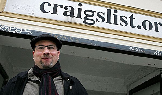 Craig Newmark standing in front of a building