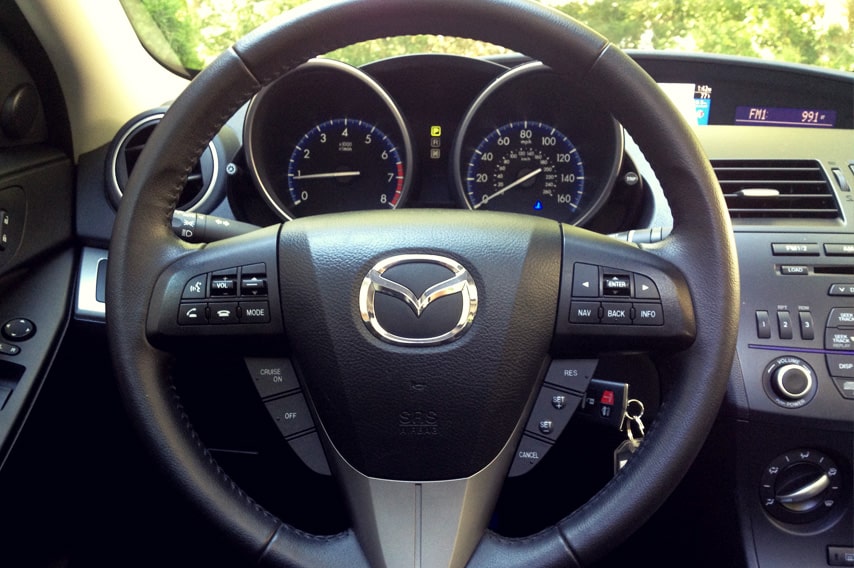 steering wheel and panel details of mazda 3i vehicle
