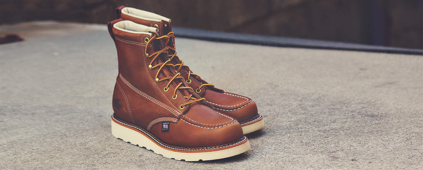 a pair of thorogood moc toe boots
