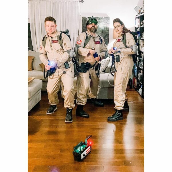 image of three people wearing ghostbuster costumes for halloween
