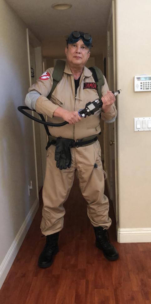 a man wearing a DIY ghostbuster halloween costume