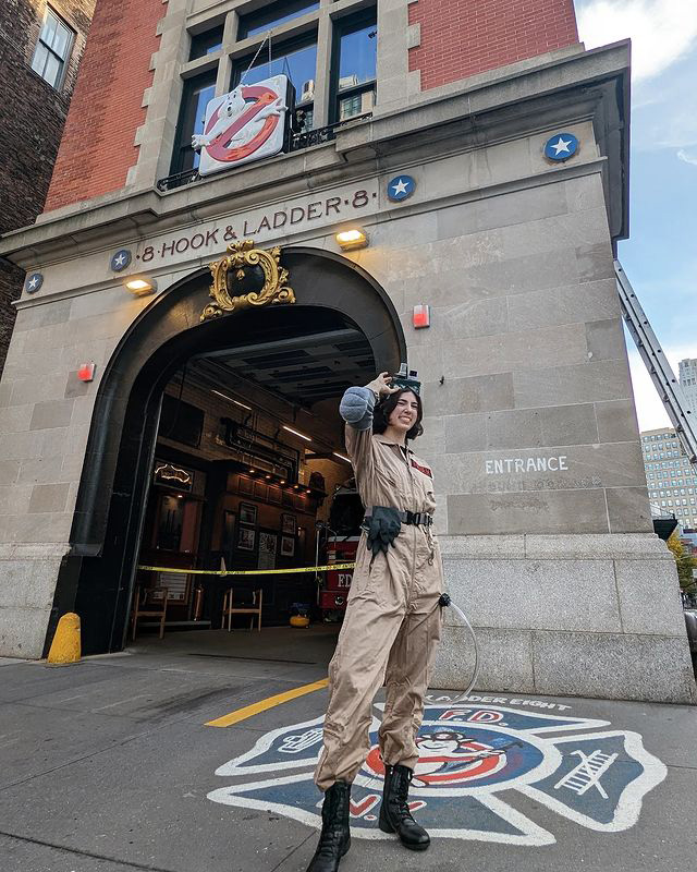 Primer reader @mayakatefrueh wearing a Ghostbuster costume in front of the actual firehouse in New York