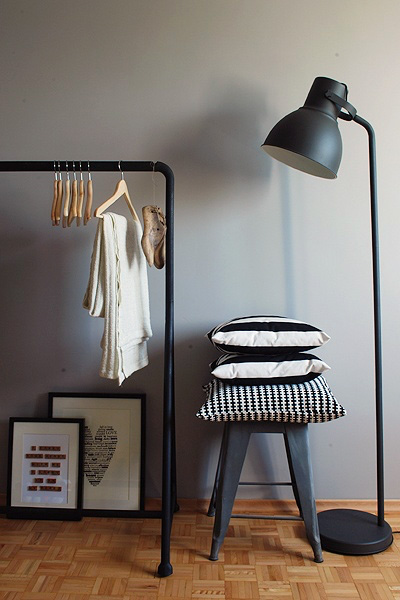 A lamp that is sitting next to a stool