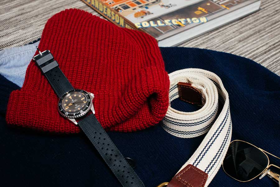 close up of cap belt and watch