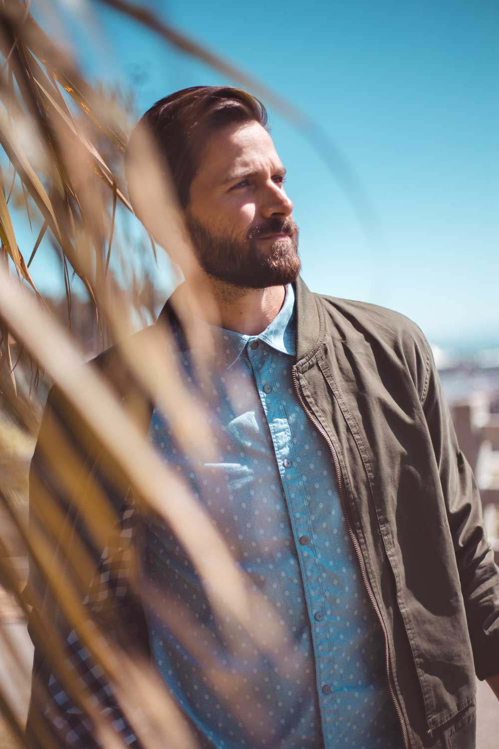 Photo of man wearing a jacket and button up shirt