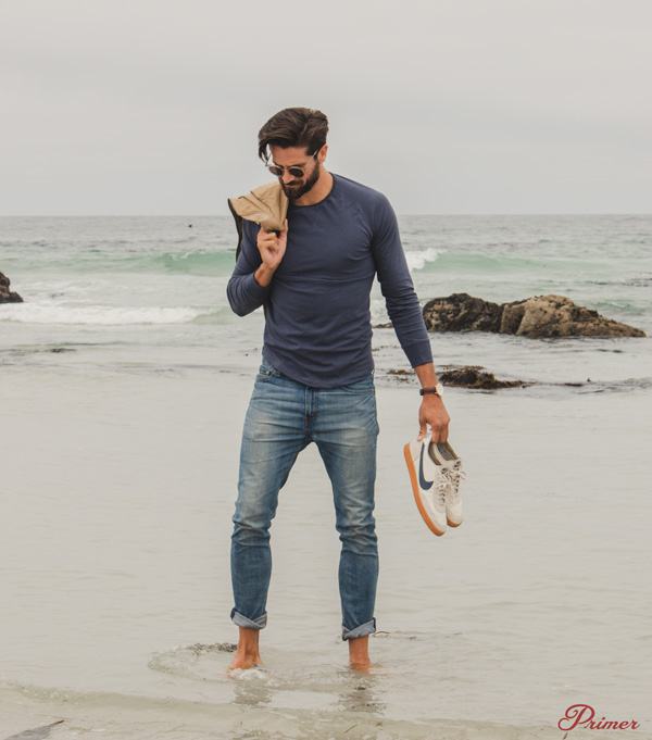 A person standing next to a body of water