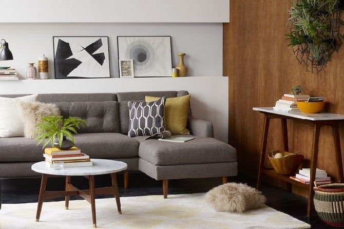 A living room filled with furniture and a table