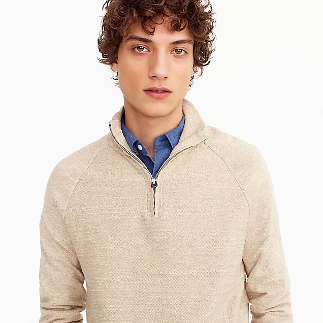 Cream colored zip up sweater
