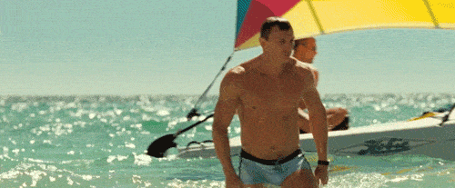 james bond coming out of ocean in swim suit
