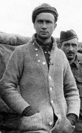 A vintage photo of a man wearing a sweater