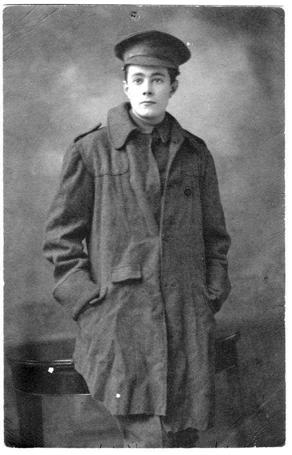 A vintage photo of a soldier wearing a trench coat