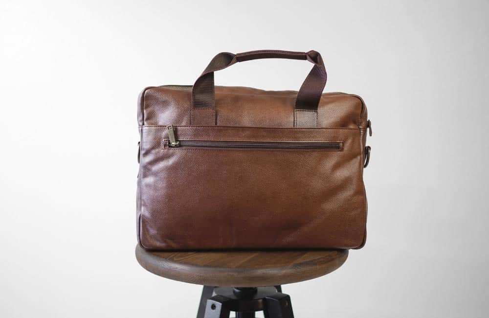 back pocket of brown leather briefcase