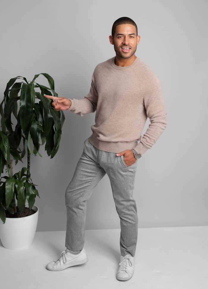 tan sweater gray pants white sneakers men's minimalist fashion inspiration outfit