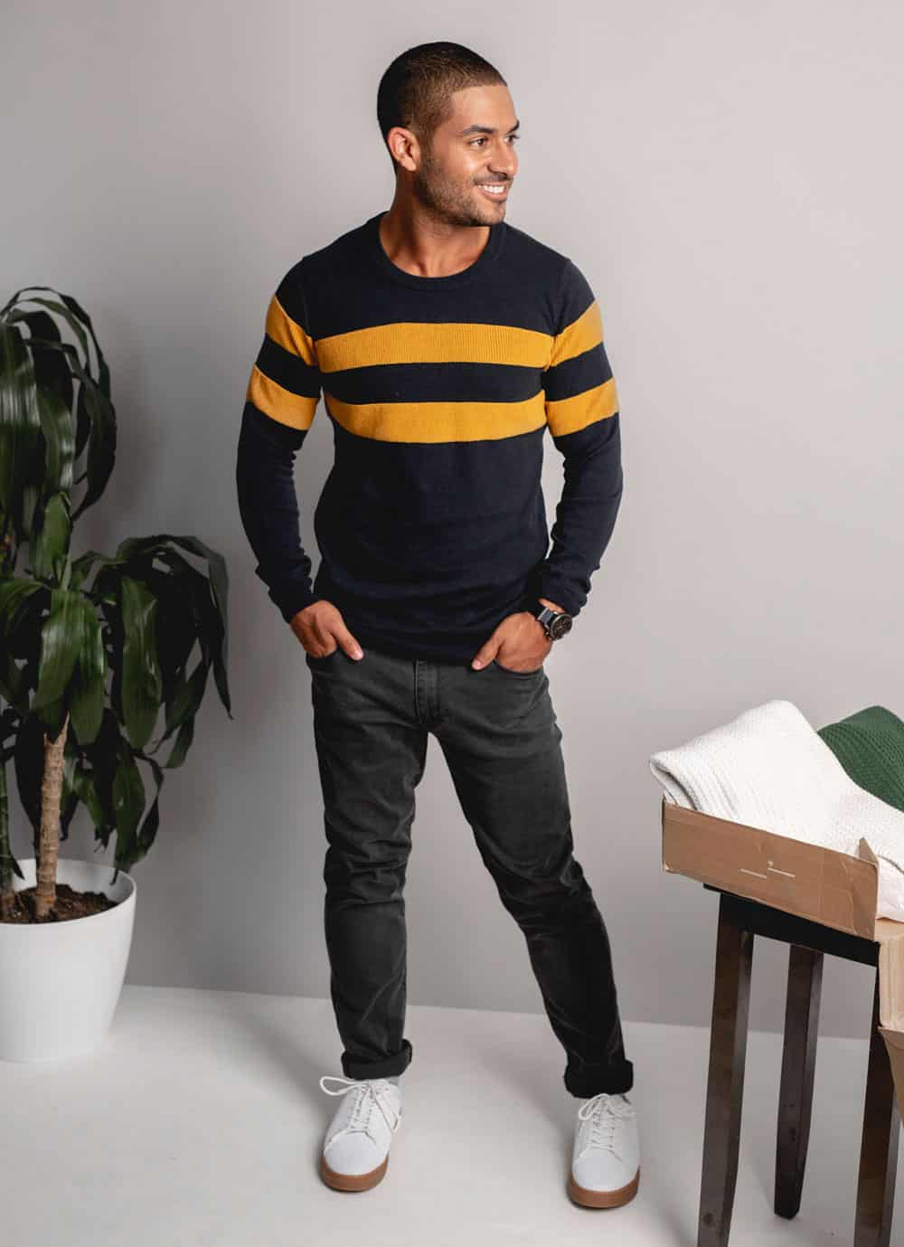 man wearing a sweater from Frank and Oak with pants and gum sole shoes