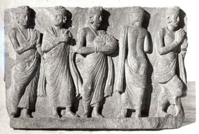 Ancient sculpture of people in robes