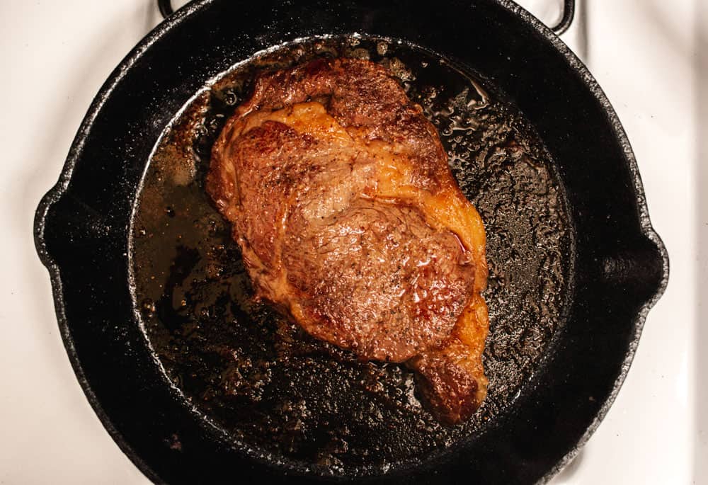 seared steak in pan