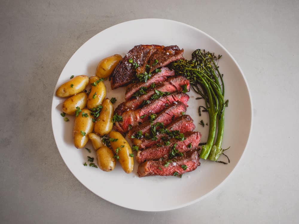 sliced steak potatoes broccolini