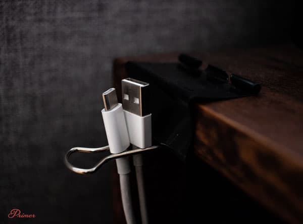 use a binder clip to store cables behind a desk or table lifehacks