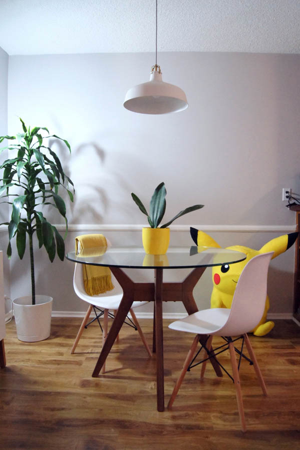 apartment dining room with whale fin snake plant