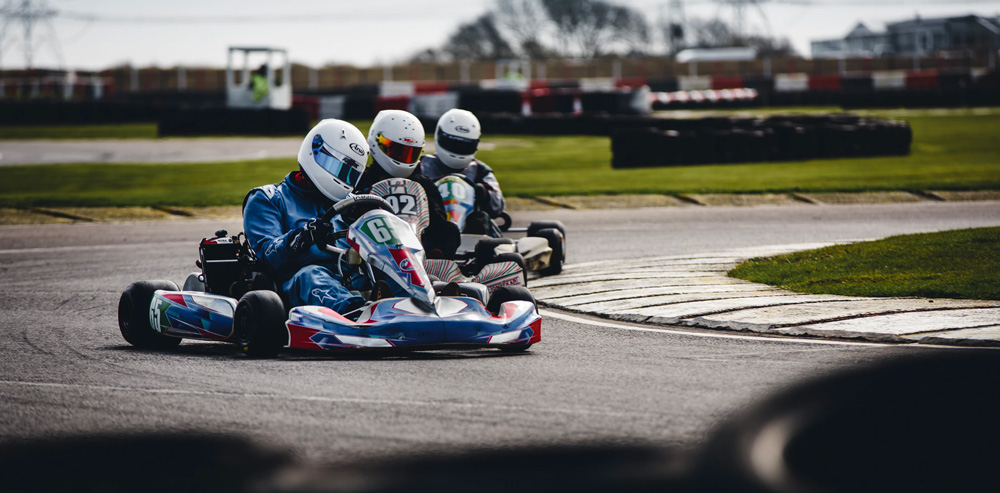 three people on go karts for a bachelor party activity