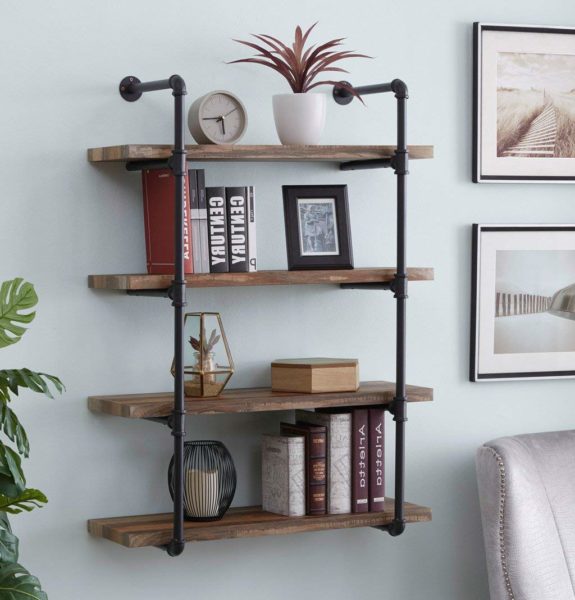 a space saving rustic wood and pipe shelf with books and small home decor items